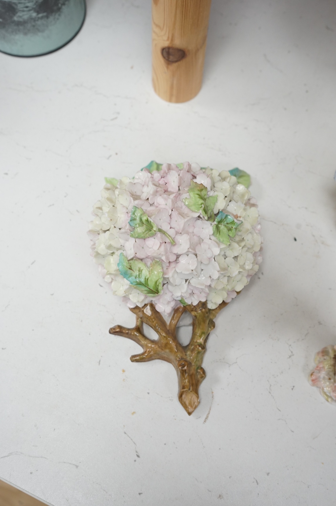 A group of English porcelain flower encrusted scent bottles and yours, Coalport, Minton etc., c.1830-50 together with Continental porcelain figures a wall pocket etc, largest 26cm high